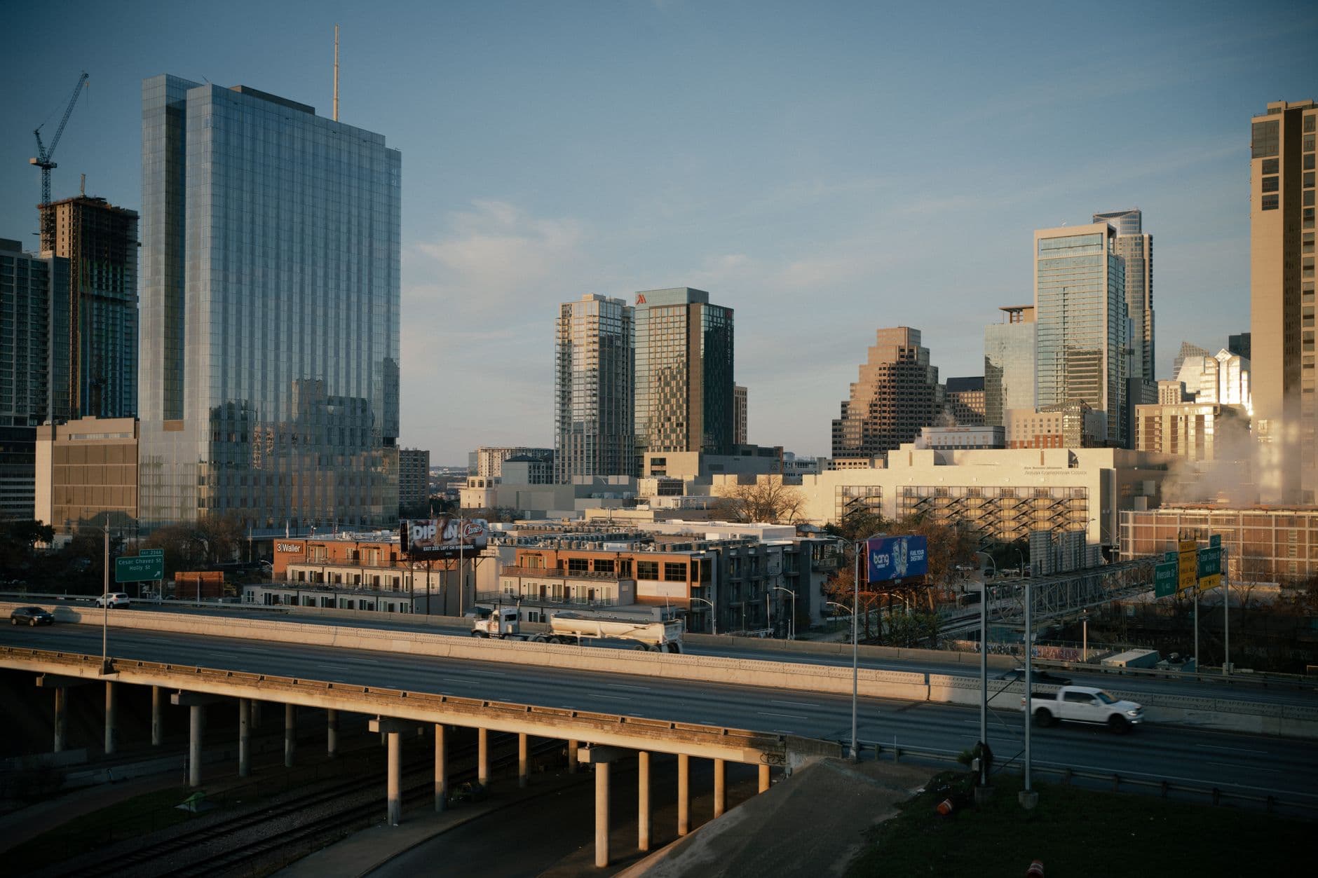 Aerial view of downtown Austin, Texas showcasing modern skyscrapers and urban infrastructure at dusk.